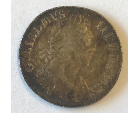 A WILLIAM III SHILLING. A William III Shilling dated 1697, first draped bust r, reverse with crowned cruciform shield, 'B' be