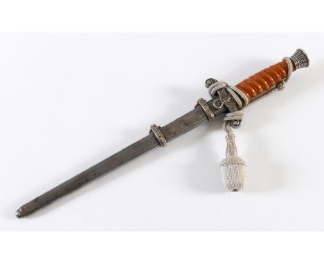 A GERMAN ARMY OFFICERS DAGGER AND SCABBARD BY EICKHORN. The 24cm pointed blade marked 'Original Eickhorn Solingen', the cross