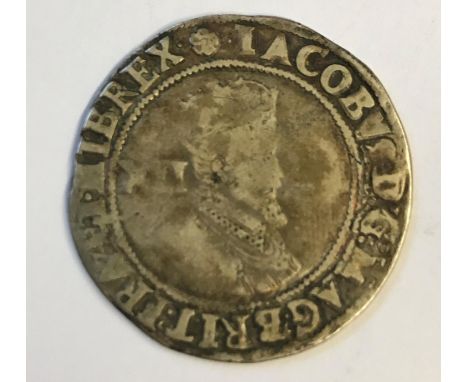 A JAMES I SHILLING. A James I hammered shilling, crowned portrait right, mint mark rose, second or third coinage. 31mm wide, 