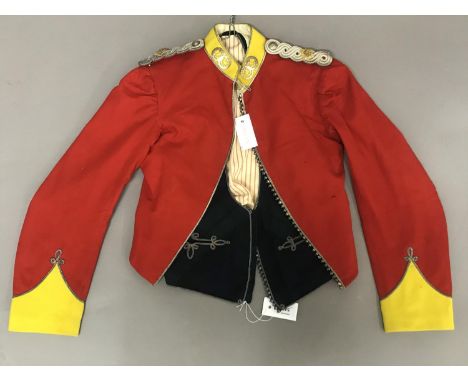 AN ARGYLL AND SUTHERLAND HIGHLANDS MESS JACKET AND WAISTCOAT. The waistcoat tartan fronted with two flat fronted pockets with