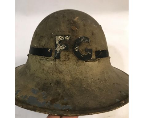 A SECOND WORLD WAR 'FIRE GUARD' HELMET AND GAS MASK ETC. A World War II 'Zuckerman' Fire Guard helmet with black band and 'F.