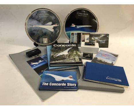 A COLLECTION OF CONCORDE RELATED ITEMS. The collection comprising two limited edition ceramic plaques 'Concorde Legend of the