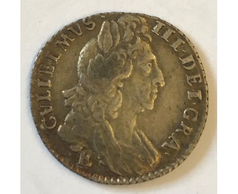 A WILLIAM III SIXPENCE. A William III Sixpence dated 1697, third draped bust r, E below the bust for the Exeter mint.