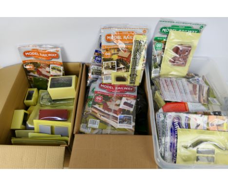 Hachette - Assorted carded issues of OO gauge 'Your Model Railway Village'. Includes 59 complete issues in factory sealed bag