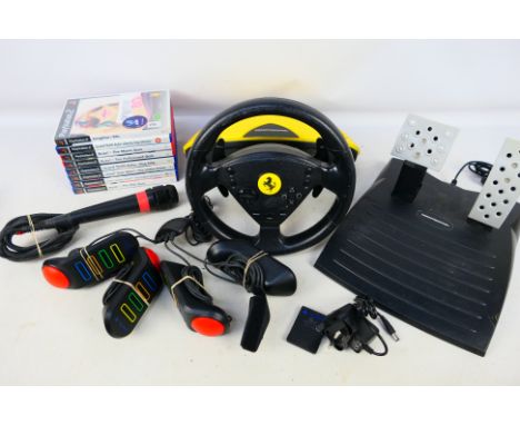 Sony - Playstation - A group of games and accessories including Thrustmaster Steering Wheel and pedals, a Singstar microphone