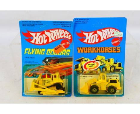 Mattel - Hot Wheels - A pair of carded Hot Wheels vehicles including Flying Colors Cat Bulldozer #1172 and Workhorses Cat Whe