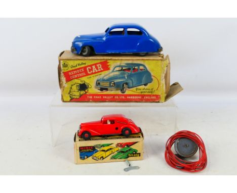 Chad Valley - Tri-ang - 2 x boxed clockwork cars, a Chad Valley remote control car with rubber squeeze button and tube showin