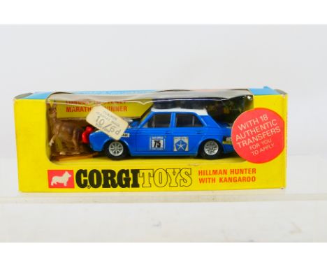 Corgi - Golden Jacks - A boxed Hillman Hunter Rally Car with Kangaroo # 302. The car appears Mint with figure and paperwork, 