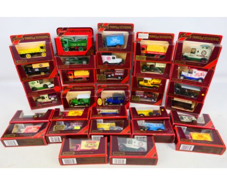 Matchbox - 32 boxed diecast Models of Yesteryear. Includes Y30 1920 model AC Mack, Y22 1930 model A Ford Van, 2 x Y-13 1918 C