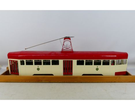 Beatties - An assembled kit / scratch built model tram (approximately 93cm long) constructed with balsa wood and painted red 