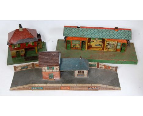 Three trays containing accessories:- two large rotating deckside style cranes (German US Zone), 3 x confectionery tins decora