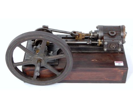 An early 20th century brass and gunmetal constructed stationary horizontal mill engine comprising of wooden clad single cylin