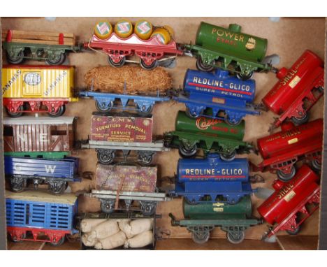 Pre-war Hornby:- 10 wagons and 8 tanks; including timber, Fyffes, NE goods brake, GW 'B' open, milk traffic, 2 x LMS flat, fi