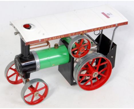 A Mamod TE1A traction engine comprising green and red body with original scuttle (missing burner), appears to have had very l