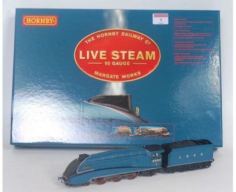 A Hornby line steam 00 gauge class A4 "Seagull" engine and tender LNER blue, appears unused and complete with accessories