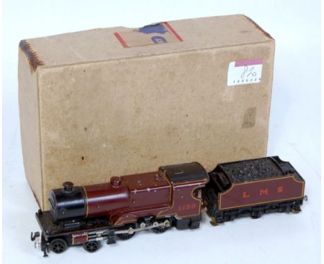 A Trix Twin Ref. 2/536 post war LMS maroon 4-4-0 engine and tender in original box with oil bottle loco and tender has some a