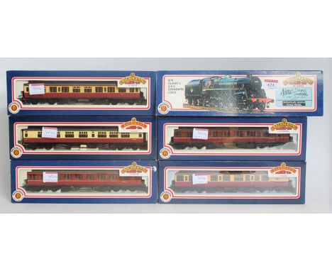 A Bachmann 31-104 BR lined green class 4 double chimney engine and tender no. 75069 (NM-BNM), together with 2 Collett maroon 