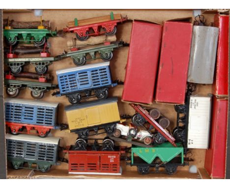 Large tray containing 18 Hornby wagons, mixture of pre- and post-war including 3 lumber, 2 cattle, 3 milk traffic, 2 LMS hopp