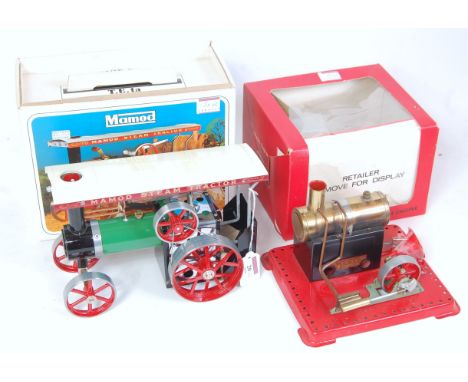 A Mamod TE1a steam tractor appears complete with usual accessories and unused and sold with a SE1a stationary steam engine in