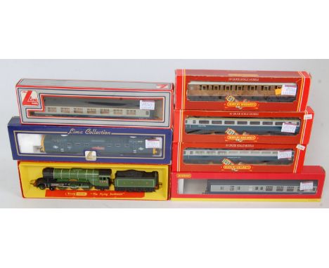 A Triang Hornby R855 LNER green 'Flying Scotsman' engine and tender box with outer card sleeve (G-BG) R477 teak coach (G-BG),