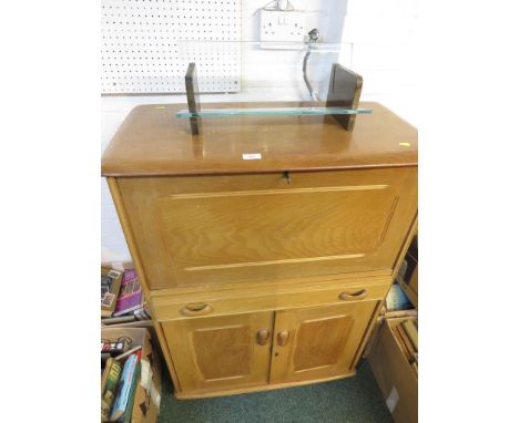 A LIGHT WOOD TWO-DOOR CUPBOARD WITH FALL-FRONT COMPARTMENT AND SINGLE DRAWER.