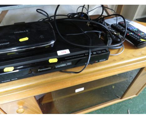 A HUMAX FREE SAT BOX AND A PANASONIC DVD RECORDER WITH INSTRUCTIONS AND REMOTE.