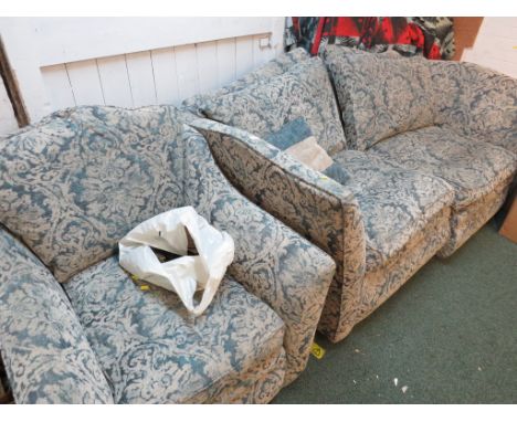 LARGE TWO-SEATER SOFA AND MATCHING ARMCHAIR IN A BLUE CLASSICAL PATTERN. (AF)