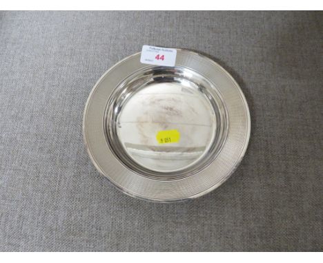 SILVER-PLATED CIRCULAR DISH WITH ENGINE TURNED BORDER AND TWO INDISTINCT STAMPED MARKS