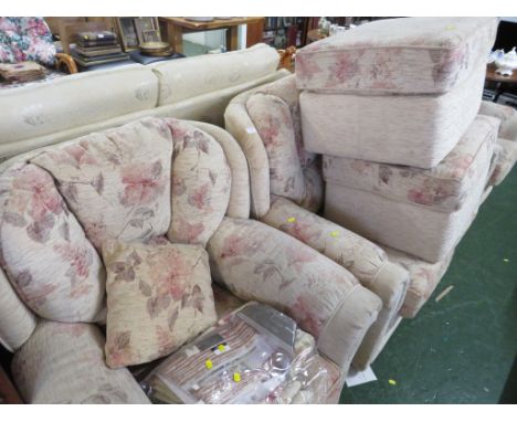 BEIGE FLORAL PATTERNED TWO-SEATER SOFA, TWO ARMCHAIRS AND TWO FOOT STOOLS.