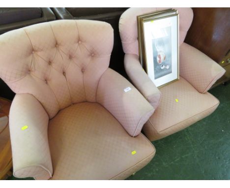 A PAIR OF HORSEHAIR STUFFED BUTTON BACK ARMCHAIRS IN LIGHT RED PATTERNED UPHOLSTERY, STANDING ON BRASS CASTERS.