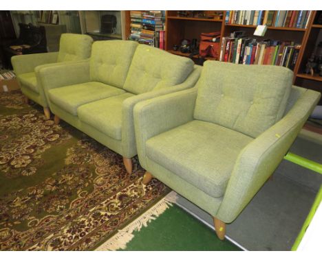 ERCOL THREE PIECE SUITE UPHOLSTERED IN PALE GREEN WITH LIGHT WOOD LEGS.