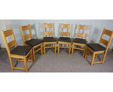 A set of six oak ladder back dining chairs, contemporary, of solid frame construction, with lightly curved backs and square s