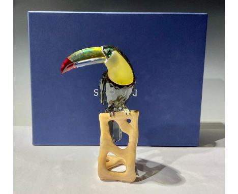 A Swarovski model of a Toucan, resting on a naturalistic wooden base, 20cm, certificate, boxed 