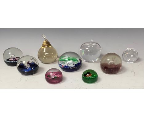 A Scandinavian Swedish clear glass apple shaped paperweight, signed, 8cm, marked Boda; a Caithness Pluto pattern, limited edi