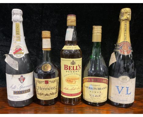 A bottle of Bell's Scotch whisky; others, Hennessy Cognac; Martini Asti-Spumante; Napoleon Brandy; Tattinger Brut Champagne (