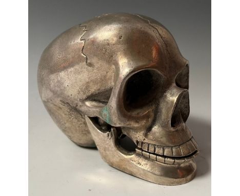 Memento Mori - a cast metal model of a human skull, with articulated lower jaw, 9.5cm high 