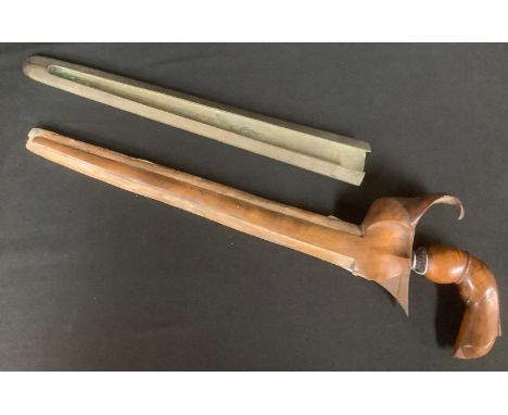 A Malaysian Kris dagger, carved wooden handle, brass mounted wooden scabbard, late 19th century 