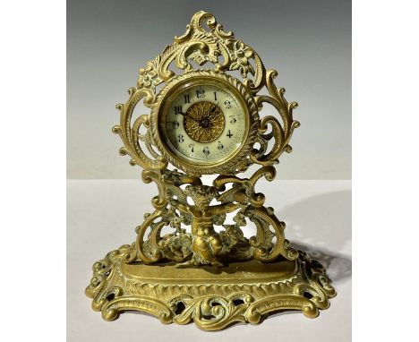 A Victorian ornate brass cherub mantel clock 