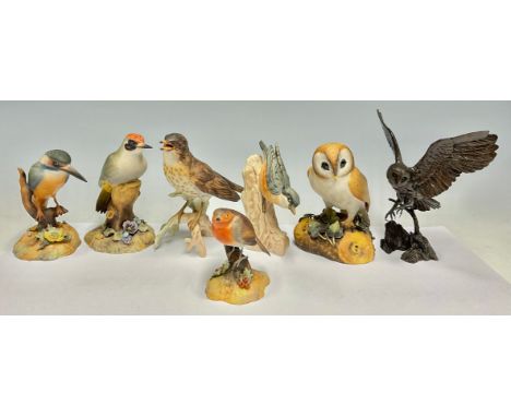 A Royal Crown Derby model, of a Barn Owl, 14cm high; others, Kingfisher, Woodpecker, Robin; a Goebel model, of a Thrush; anot