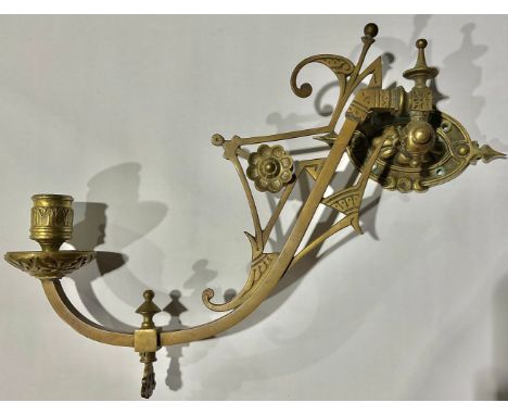 A Victorian Aesthetic Movement brass wall light 