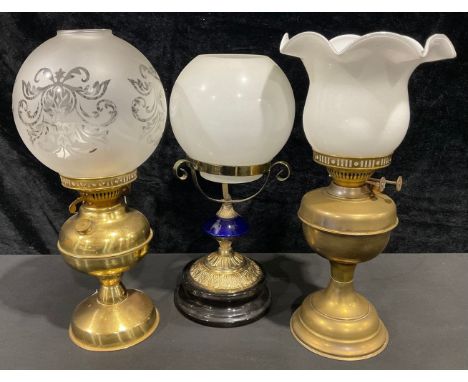 A brass Duplex oil lamp, globular frosted glass shade; another, frilled shade; an oil lamp base and shade (3) 
