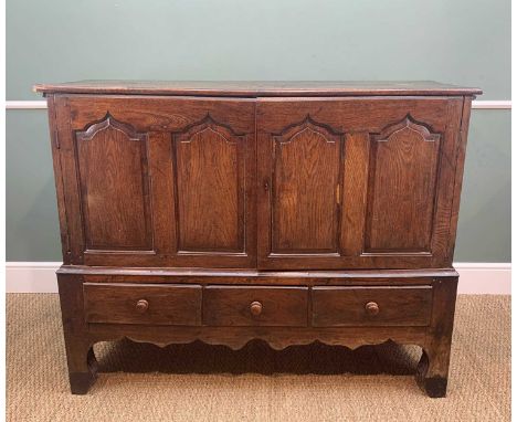 18TH CENTURY JOINED OAK MULE CHEST, later converted to a cupboard, with plank top above fielded panelled doors and sides, thr