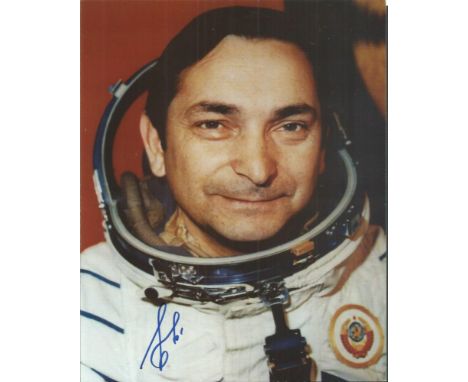 Valery Bykovsky autographed photo. Colour 8x10 space suit portrait photo signed by cosmonaut Valery Bykovsky.  Good condition