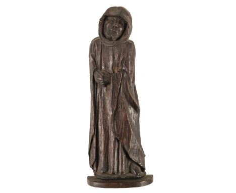 * North European School. Standing figure of a monk, probably Flemish or German, 17th century, carved oak figure of a bearded 