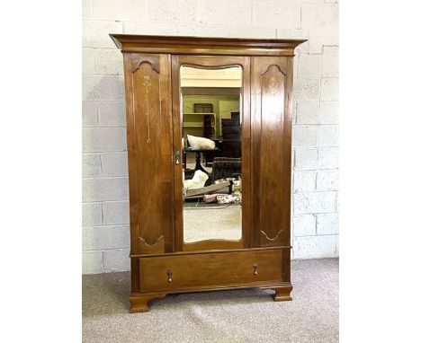 An Edwardian Art Nouveau style wardrobe, with mirrored door and inlaid panels, 198cm high, 136cm wide