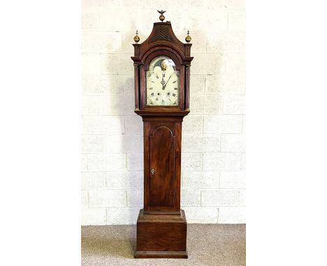 A late Georgian provincial mahogany moonphase longcase clock, early 19th century, with an arched top and pierced fretwork sur