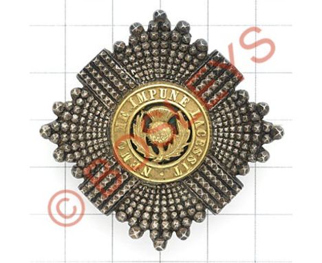 Scots Guards Officer's forage cap badge.A good unmarked Thistle star mounted with rich gilt motto and Thistle on green transl