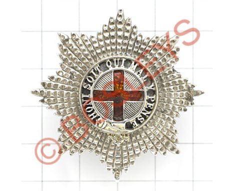 Coldstream Guards Warrant Officer's cap star.A fine cut silvered example; the gilt Garter pierced with blue enamel ground, ce