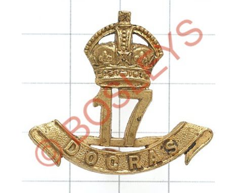 Indian Army. 17th Dogra Regiment gilt brass cap badge.Die-cast crowned '17' resting on a scroll inscribed 'Dogras'. J.R. Gaun