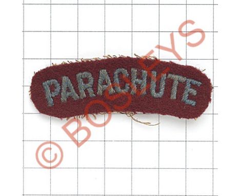 PARACHUTE small light blue on maroon embroidered shoulder title.Sans-serif letters. Oval ends   Removed from uniform. GC 
